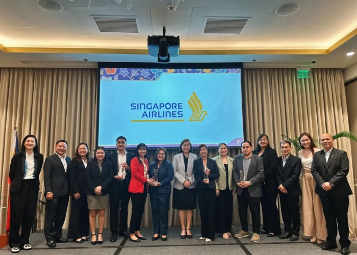Airtropolis Consolidator Phils., Inc. representatives at the Singapore Airlines awarding event with airline branding in the background